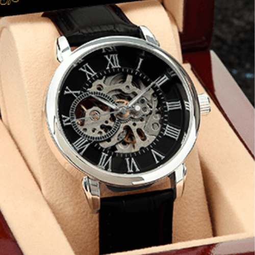 Black wristwatch with a detailed mechanical design on a beige background