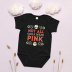 Black baby onesie with 'Not All Girls Wear Pink' text on a light pink background with decorative elements.