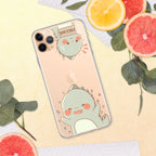 Phone case with a cute green dinosaur design on a yellow background with sliced oranges and leaves.