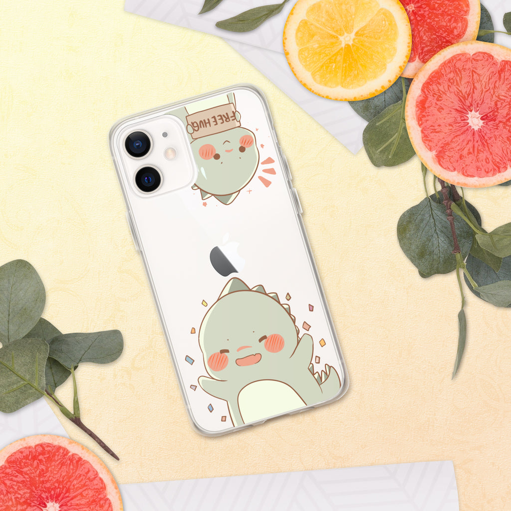 Phone case with a cute green dinosaur design on a yellow surface with fruit and leaves.