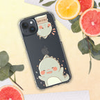 Phone case with cute dino design on a surface with fruits and leaves