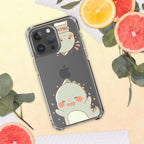 Phone case with a cute dino design on a yellow surface with fruits and leaves