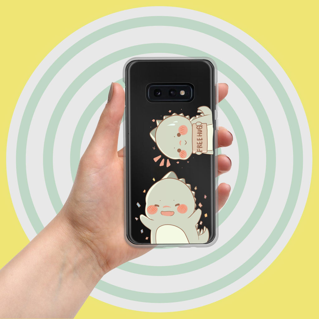 Hand holding a phone case with cartoon cat design against a yellow background