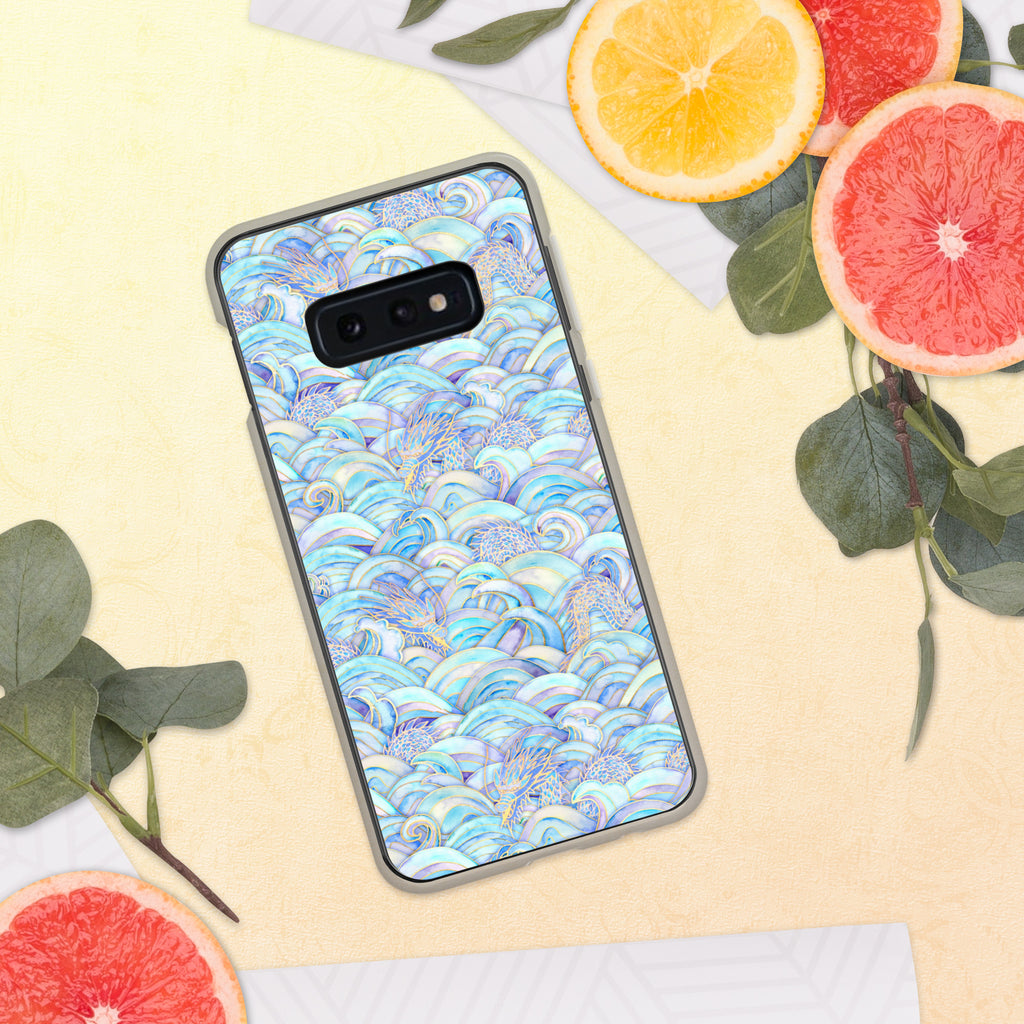 Phone case with a blue wave pattern on a yellow surface with fruit and leaves.