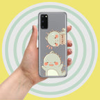 Phone case with cartoon dinosaur design held by a hand against a yellow background