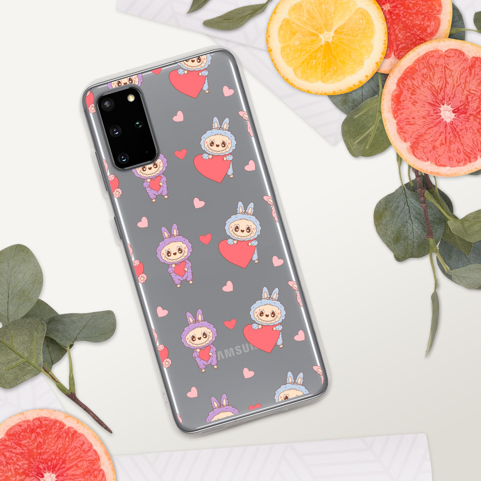 Phone case with cartoon design on a white surface with fruits and leaves