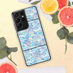 Phone case with a blue wave pattern on a yellow surface with fruit and leaves.