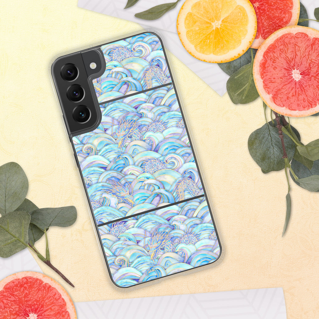 Phone case with a colorful wave pattern on a yellow surface with fruit and leaves.