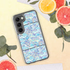 Phone case with wave pattern on a yellow surface with fruit and leaves