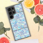 Phone case with wave pattern on a yellow surface with fruit and leaves
