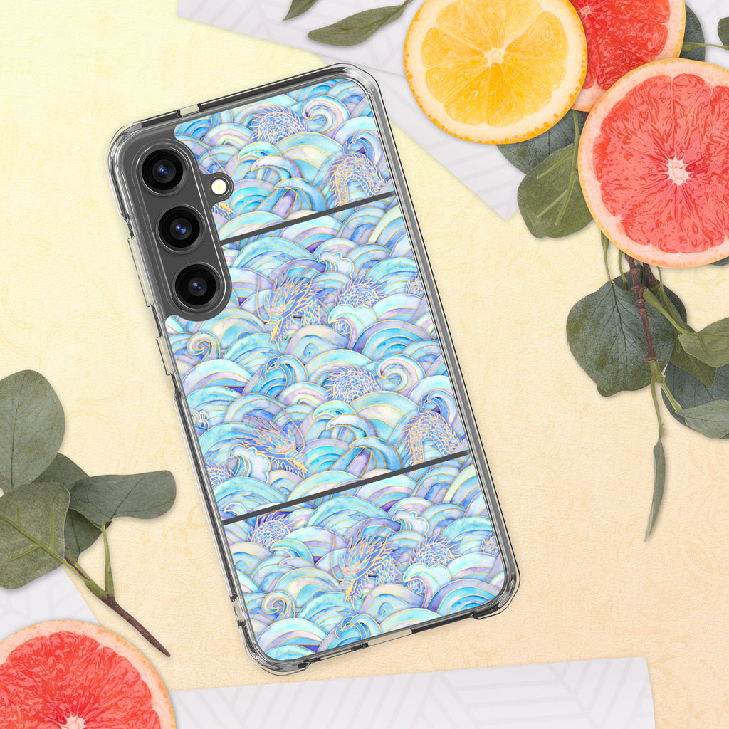 Phone case with a colorful wave pattern on a yellow surface with fruits and leaves.