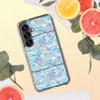 Phone case with ocean wave design on a yellow surface with fruit and leaves