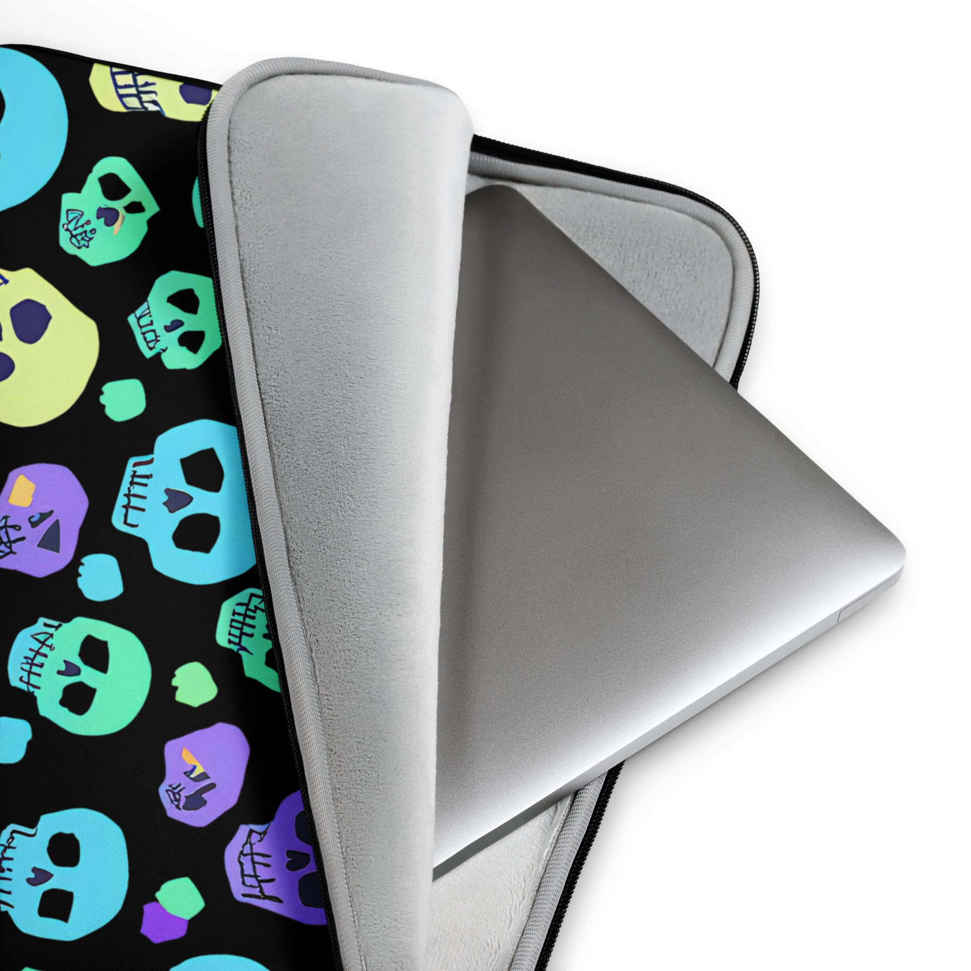 Laptop with colorful skull patterned sleeve on a white background