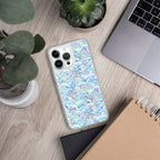 Phone case with a colorful pattern on a wooden surface with a plant and laptop.