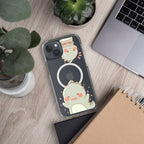 Phone case with cartoon design on a desk with laptop, notebook, and plants
