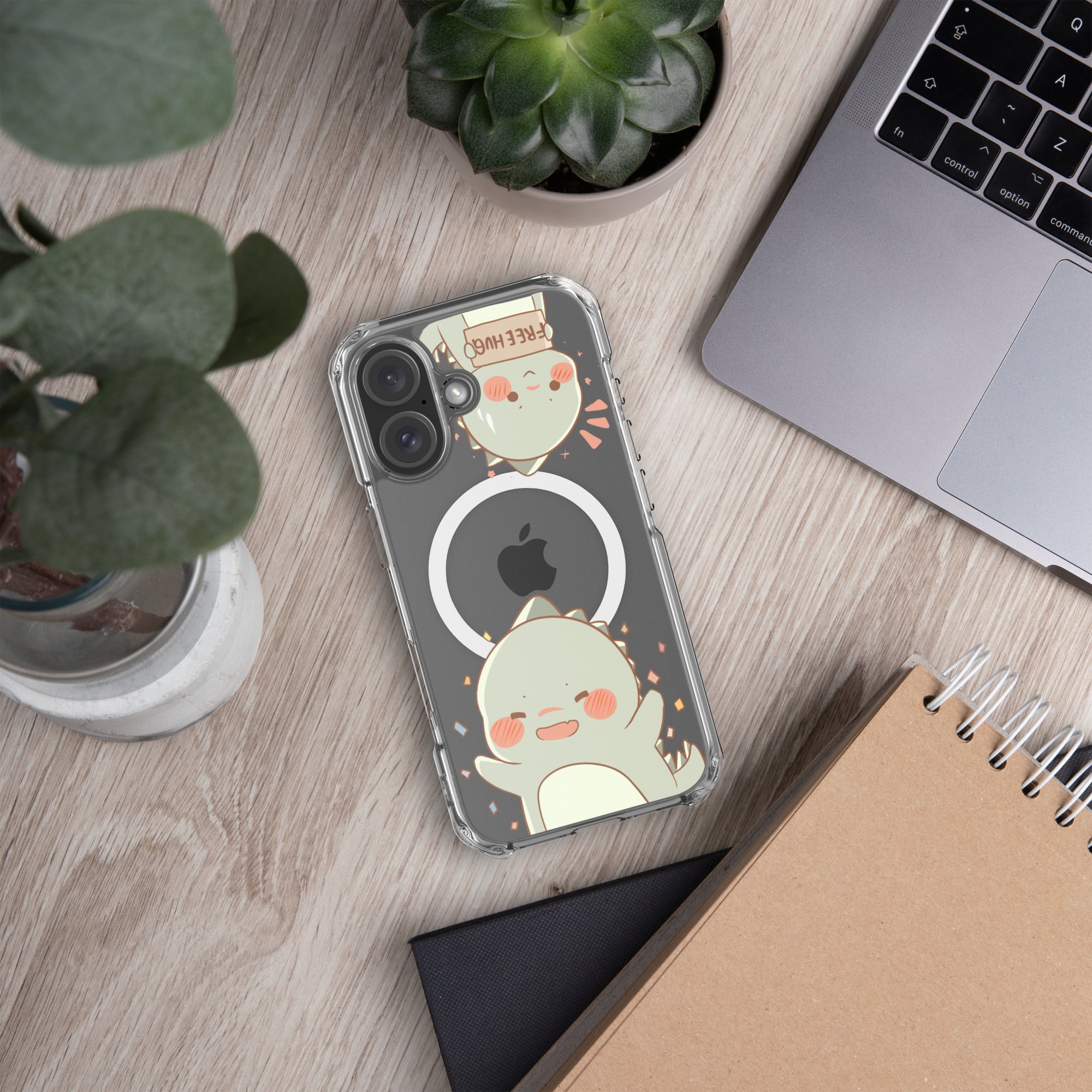 Phone case with cartoon design on a desk with laptop and plants