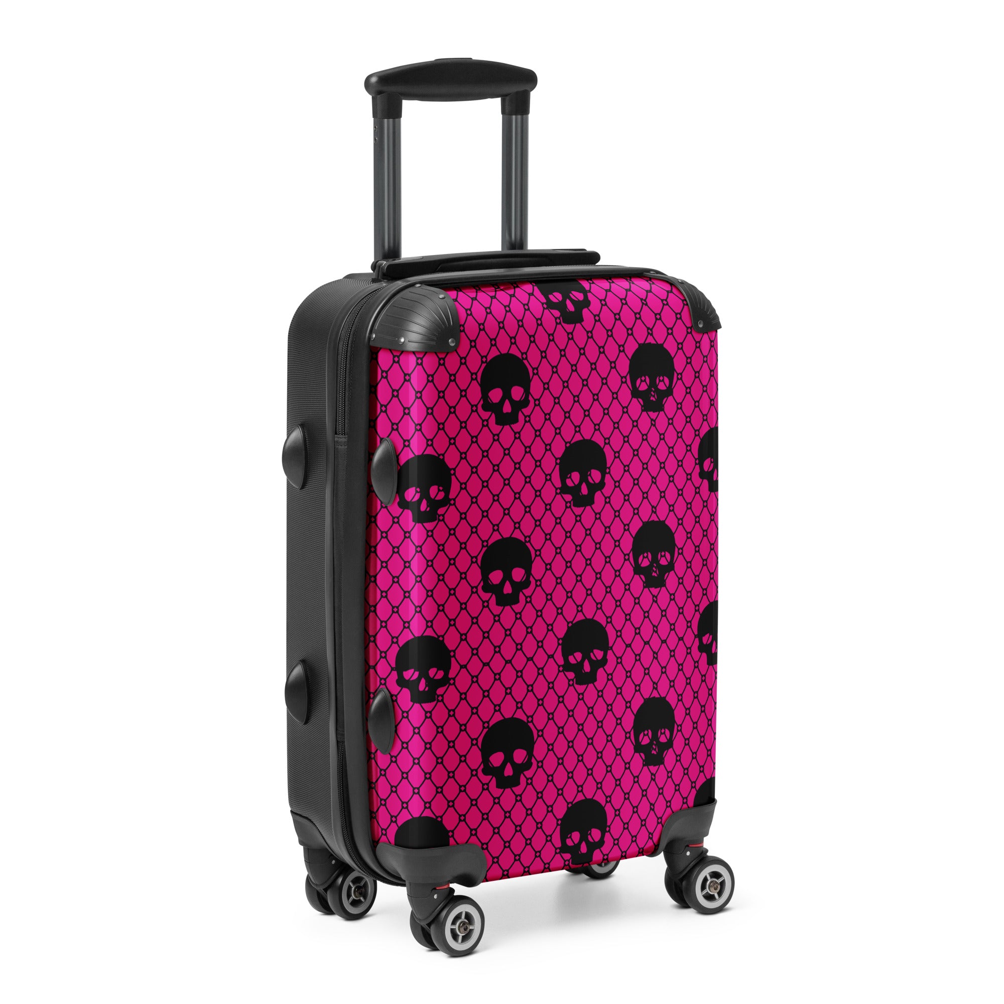 Pink suitcase with black skull pattern on a white background