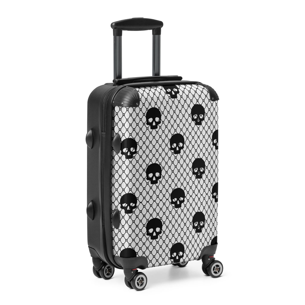 Black and white suitcase with skull pattern on a white background