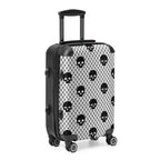 Black and white suitcase with skull pattern on a white background