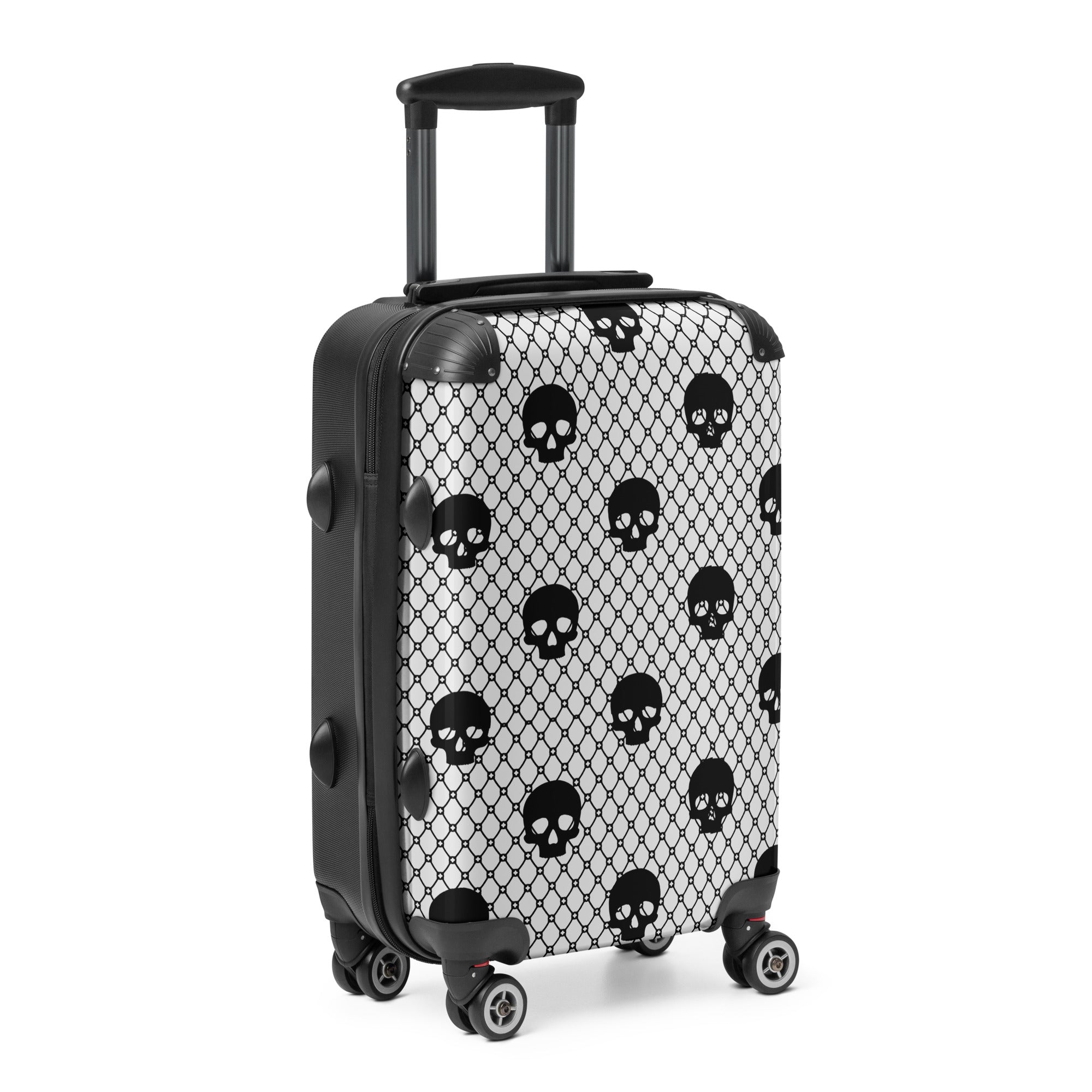 Black and white suitcase with skull pattern on a white background