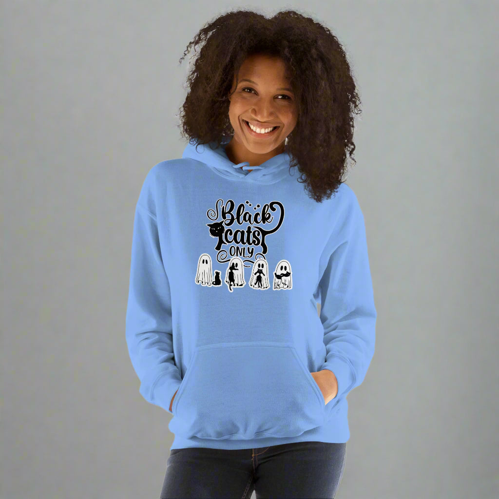 Person wearing a light blue hoodie with 'Black Cats Only' text and graphics on a white background