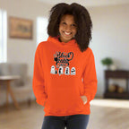 Person wearing an orange hoodie with Halloween-themed design on a white background
