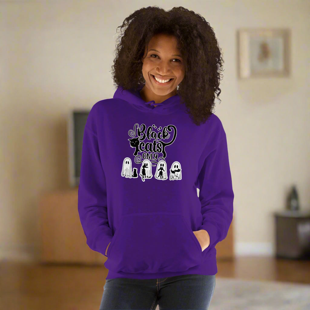 Person wearing a purple hoodie with text and graphics on a white background